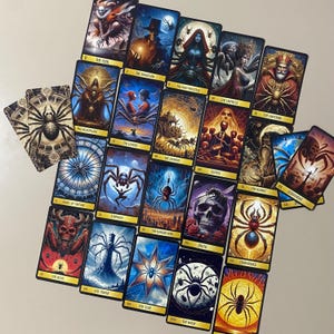 May include: A tarot deck with black and gold accents featuring illustrations of various creatures and symbols. The cards are laid out in a spread, showing the Fool, Magician, Empress, Emperor, Hierophant, Lovers, Chariot, Justice, Hermit, Wheel of Fortune, Strength, Hanged Man, Death, Temperance, Devil, Tower, Star, Moon, and Sun.