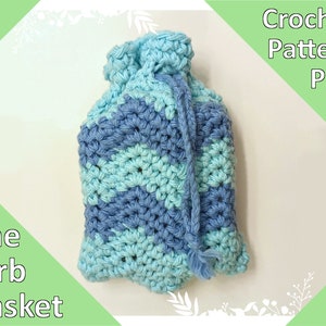 May include: A crocheted blue and turquoise drawstring bag with a chevron pattern. The bag is labeled "The Birb Basket" and "Crochet Pattern PDF".