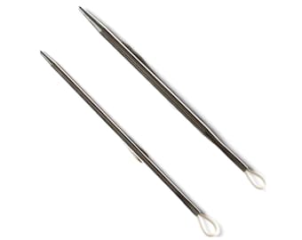 May include: Two silver knitting needles with loops at the ends.