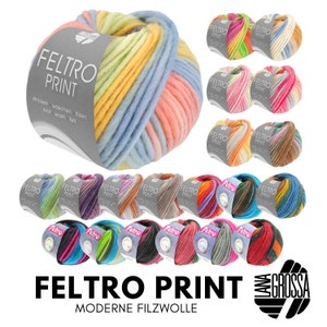 Puede incluir: Una variedad de ovillos de lana de colores con el texto "FELTRO PRINT" y "MODERNE FILZWOLLE" en la parte inferior. La lana es una mezcla de lana y fieltro.