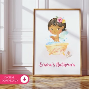 May include: A framed watercolor print featuring a cartoon fairy in a yellow bathtub with bubbles. The fairy has dark hair, a flower crown, and wings. The text "Emma's Bathroom" is written in pink script below the image.
