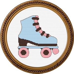 May include: A blue and pink roller skate with black wheels and a black strap. The skate is framed in a gold-colored frame.
