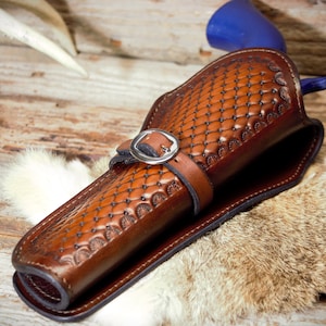 Western single action revolver holster with hand tooled quilted pattern