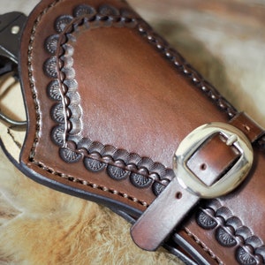Western Leather holster with hand tooled border