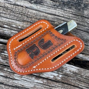 trapper sheath with personalized initials.