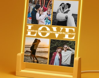 May include: A wooden photo frame with a warm yellow LED light. The frame displays four photos and the word "LOVE" in large, illuminated letters. The text "You make my life more beautiful every single day, I love you!" is also visible.
