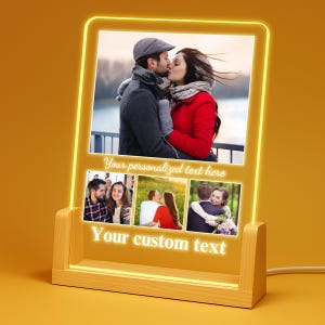 May include: A wooden photo frame with a warm yellow glow, featuring a main photo of a couple kissing and three smaller photos below. The frame includes the text "Your personalized text here" and "Your custom text".