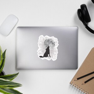 May include: A black silhouette of a wolf howling at a full moon, surrounded by white clouds.