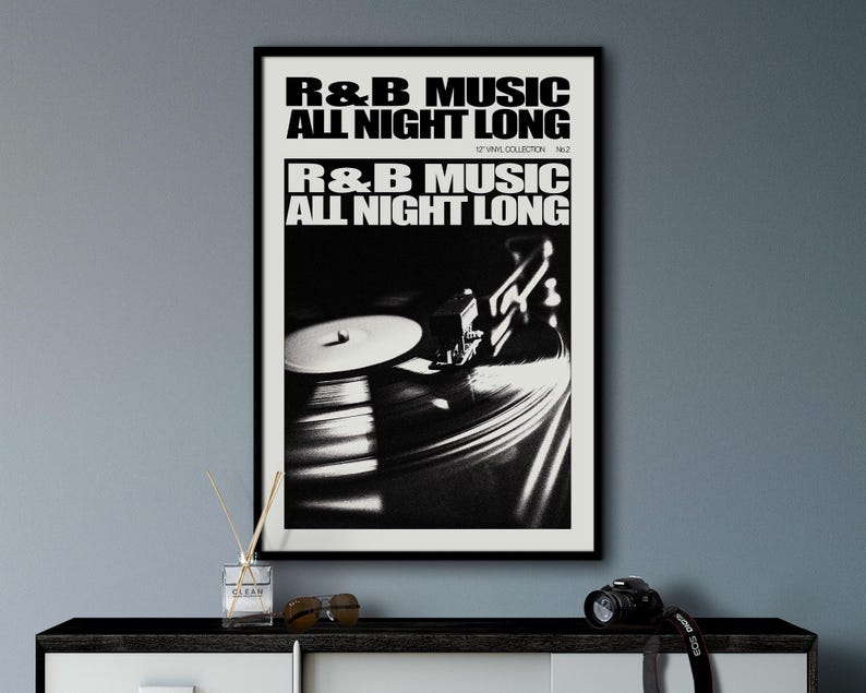 May include: Black and white photo of a record player with the text "R&B MUSIC ALL NIGHT LONG" printed on a white background.