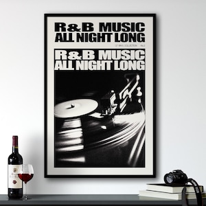 May include: Black and white poster with the text "R&B Music All Night Long" and a photo of a record player with a vinyl record on it.