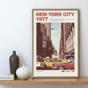 May include: A vintage poster featuring a photograph of a street scene in New York City in 1977. The poster has the text "NEW YORK CITY 1977" in red and white lettering. The image shows a street with cars and people walking. The text "54TH STREET" is at the bottom of the poster.