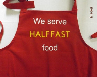 We Serve Half Fast Food Apron for Cooking, BBQ, Kitchen, Family Get-togethers