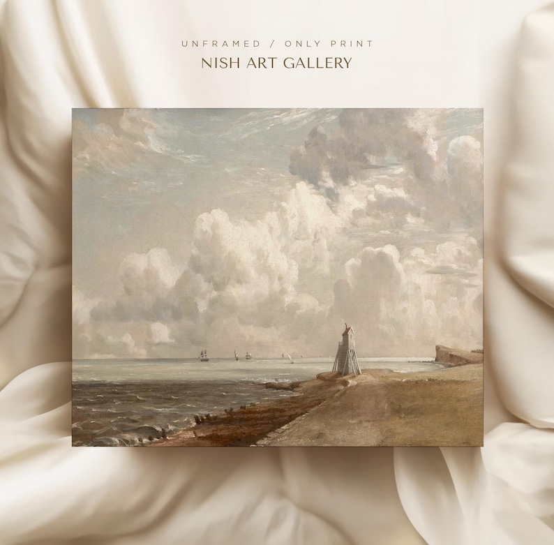 May include: A painting of a seascape with a lighthouse on a rocky shore. The sky is filled with fluffy white clouds and the sea is a calm blue. The painting is in a muted color palette and has a vintage feel.