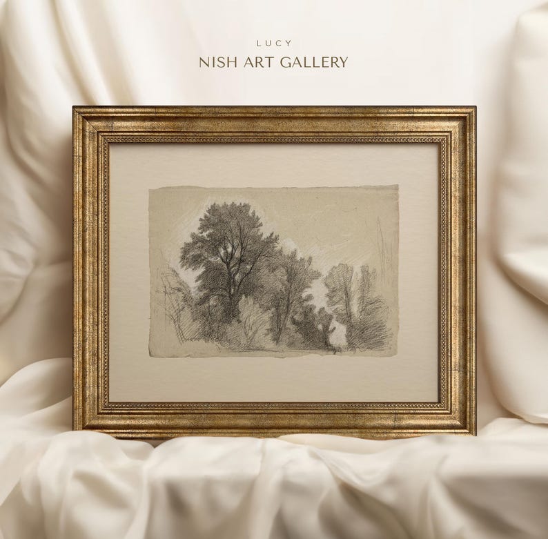 May include: A framed black and white pencil drawing of a forest scene with trees and foliage. The frame is gold with a decorative border. The title "LUCY NISH ART GALLERY" is printed at the top of the frame.