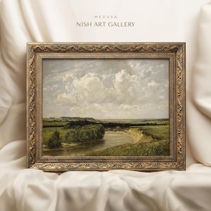 May include: A framed landscape painting depicting a river winding through a green field with a cloudy sky in the background. The frame is ornate and gold in color. The painting is titled "MEDUSA NISH ART GALLERY".