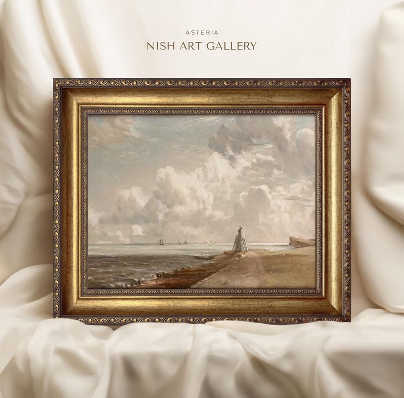 May include: A framed painting depicting a seascape with a lighthouse in the distance. The painting is set against a cloudy sky and features a calm sea with a few boats in the distance. The frame is gold and ornate.