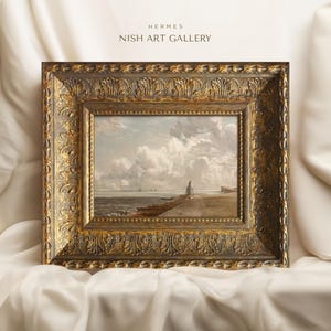 May include: A framed painting of a seascape with a cloudy sky and a distant shoreline. The frame is ornate and gold in color. The painting is titled "HERMES NISH ART GALLERY".