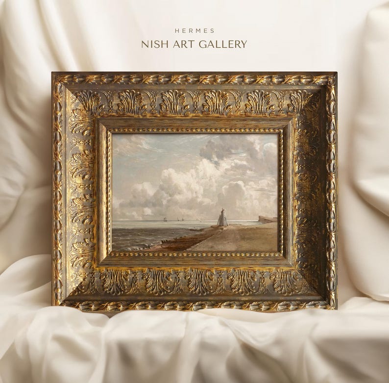 May include: A framed painting of a seascape with a cloudy sky and a distant shoreline. The frame is ornate and gold in color. The painting is titled "HERMES NISH ART GALLERY".