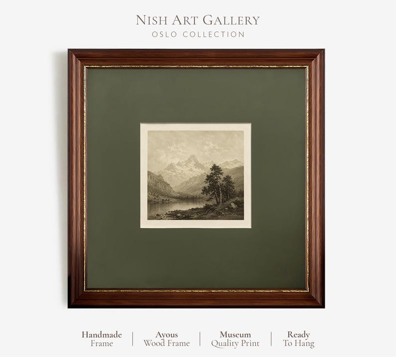 May include: A square framed art print featuring a sepia-toned landscape of mountains, a lake, and trees. The artwork is encased in a dark brown wooden frame with a gold inner trim and a wide olive green mat. Text reads Nish Art Gallery Oslo Collection.