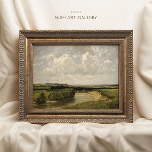 May include: A framed landscape painting depicting a river winding through a green field with a cloudy sky. The frame is gold with ornate detailing. The title "EROS NISH ART GALLERY" is printed above the painting.