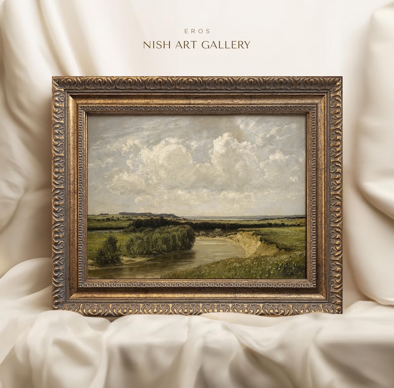May include: A framed landscape painting depicting a river winding through a green field with a cloudy sky. The frame is gold with ornate detailing. The title "EROS NISH ART GALLERY" is printed above the painting.