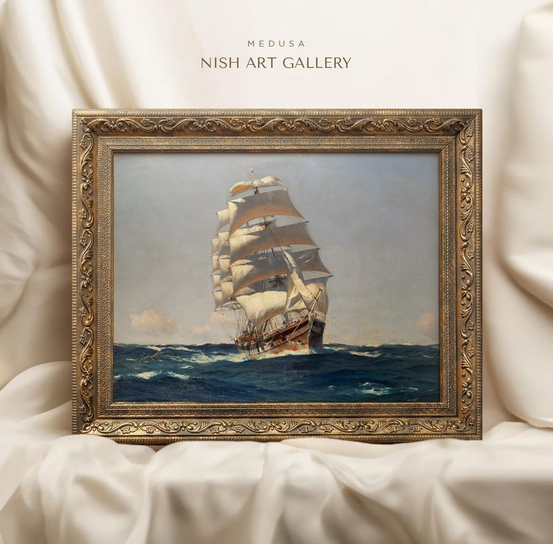 May include: A framed painting of a large sailing ship on the open ocean. The ship has white sails and a brown hull. The painting is in a gold frame with ornate details. The text "MEDUSA NISH ART GALLERY" is at the top of the image.