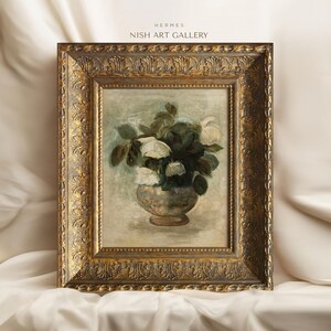 May include: A framed painting of a bouquet of white roses in a vase. The painting is in a gold frame with ornate details. The painting is titled "HERMES NISH ART GALLERY".