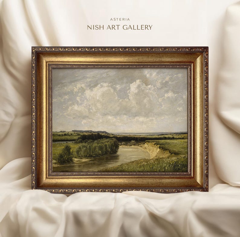 May include: A framed landscape painting depicting a river winding through a green field with a cloudy sky in the background. The frame is gold with ornate detailing. The painting is titled "Asteria Nish Art Gallery".
