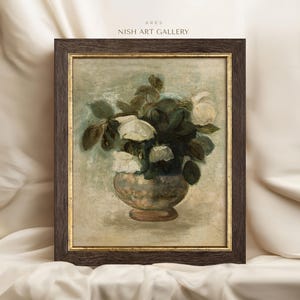 May include: A framed painting of a still life featuring a bouquet of white roses in a ceramic vase. The roses are arranged in a vase with a light brown and green pattern. The background is a light blue-green color.