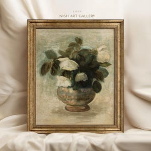 May include: A framed painting of a bouquet of white flowers in a vase. The flowers are painted in a realistic style with a focus on the delicate details of the petals. The vase is a simple, elegant design with a light brown color.