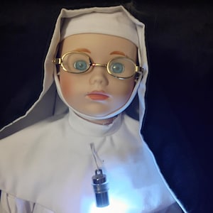 Authentic Haunted/Spirited Porcelain Nun doll Non human Neutral Guiding spirit companion Highly Active and responsive (Onk)
