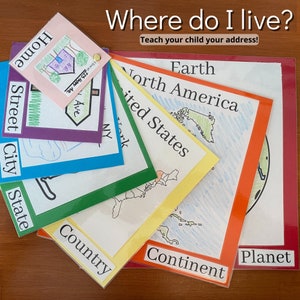 May include: A colorful educational game for children to learn about their address. The game features a series of cards with different levels of location, starting with "Home" and ending with "Planet". Each card has a corresponding map or illustration.