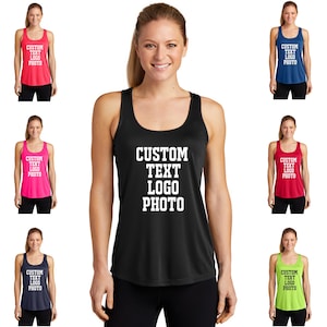 May include: A black racerback tank top with the text "CUSTOM TEXT LOGO PHOTO" printed in white on the front. The tank top is shown on a model wearing black leggings.
