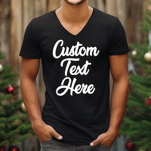 a man wearing a black t - shirt that says custom text here