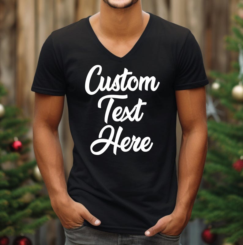 a man wearing a black t - shirt that says custom text here
