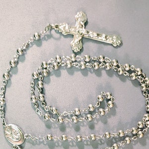 Vintage silver tone rosary and leather case