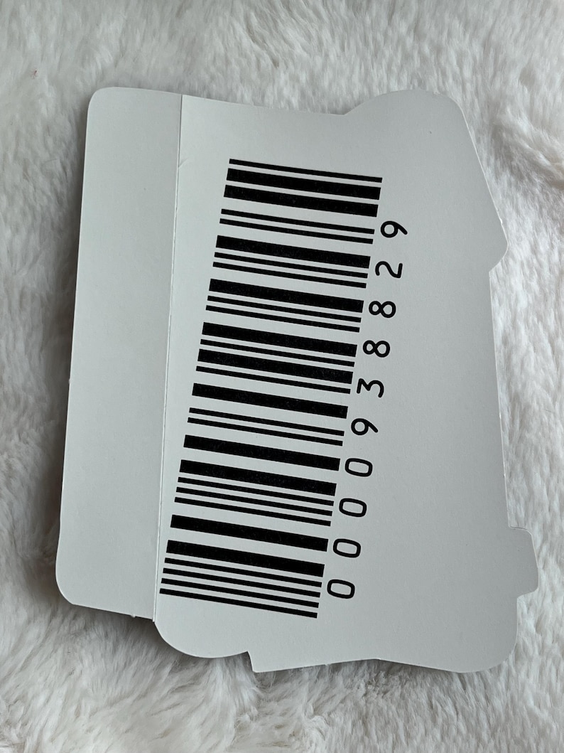 May include: A white sticker with a black barcode and the number 000938829 printed on it.