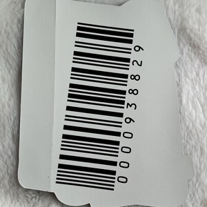 May include: A white sticker with a black barcode and the number 00009388829 printed on it.