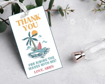 May include: Thank you for riding the waves with me!  A white thank you card with a cartoon illustration of a shark riding a surfboard with a palm tree in the background. The text "Thank You" is in large, bold, blue letters. The text "For riding the waves with me! Love, Aiden" is in smaller, blue letters.