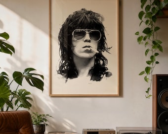 May include: Black and white framed portrait of a person wearing aviator sunglasses and smoking a cigarette. The artwork is displayed in a room with plants and a stereo system. The frame is a light brown color.