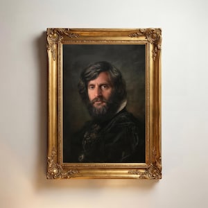 May include: An oil painting portrait of a person with dark wavy hair and a full beard, wearing a black garment with a white collar. The artwork is encased in an ornate, rectangular gold-toned frame with intricate floral and scroll carvings.