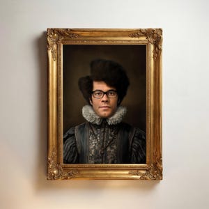May include: A portrait of a person with dark, voluminous hair and black-rimmed glasses, wearing a grey patterned doublet with a white ruffled collar. The subject is enclosed in an ornate, rectangular, antique-style gold-colored frame.