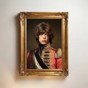 May include: A portrait painting of a person with shoulder-length brown hair, wearing a red military-style jacket with gold braided trim, epaulets, and a black sash, encased in an ornate, rectangular, antique-style gold-coloured frame.