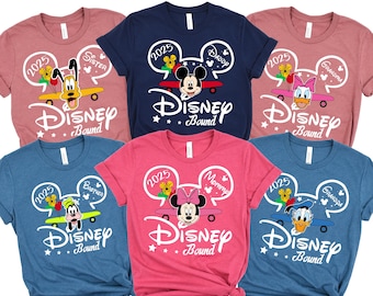 May include: Six different t-shirts with a Disney theme. Each shirt has a different character and says "Disney Bound" with the year 2025. The characters are Mickey Mouse, Minnie Mouse, Donald Duck, Goofy, Pluto, and a generic silhouette.