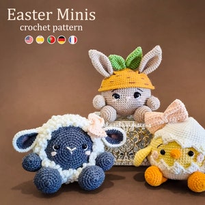 May include: Crochet Easter amigurumi pattern featuring a bunny wearing a carrot hat, a chick in an eggshell, and a lamb. The pattern is available in multiple languages.