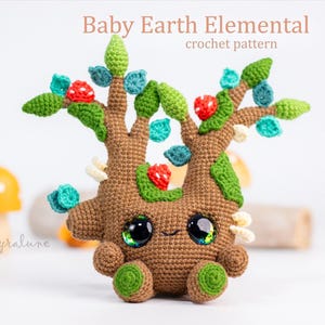 May include: A crocheted Baby Earth Elemental doll with a tree-like design. The brown body has large, expressive eyes and is adorned with green leaves, red berries, and turquoise accents. The text "Baby Earth Elemental crochet pattern" is at the top.