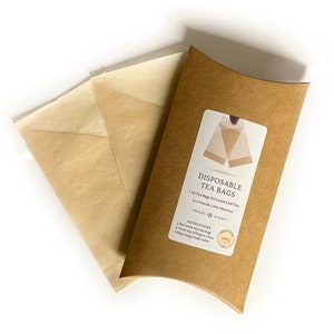 May include: A pack of 50 disposable tea bags made from eco-friendly, unbleached paper. The bags are packaged in a brown cardboard box with the text "Disposable Tea Bags - 50 Tea Bags for Loose Leaf Tea - Eco Friendly | Non-Bleached" and instructions for use.