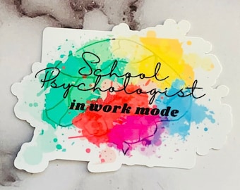 May include: A colorful sticker with a watercolor design of a brain. The text "School Psychologist in work mode" is written in black cursive lettering.