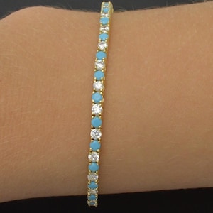 925 sterlingsilver 14k guldpläterat tennisarmband med turkosblå stenar 7,7g 7"