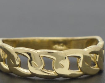 May include: A gold-colored ring with a chain link design. The ring is made of a shiny, yellow metal and has a rectangular shape. The chain links are evenly spaced around the band. Jewelry.